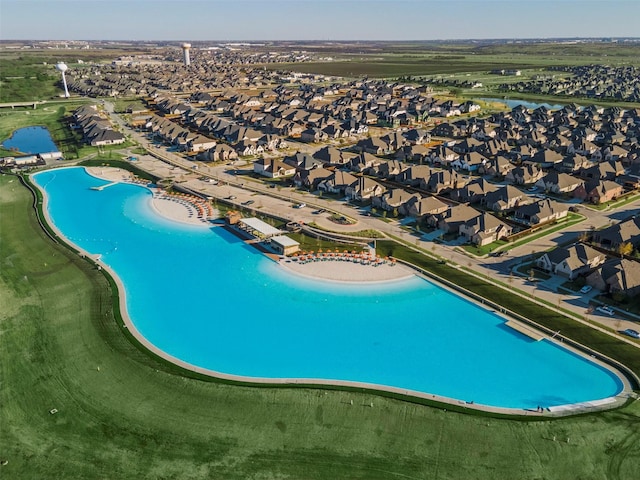 birds eye view of property featuring a residential view and a water view