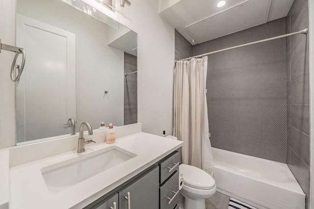 full bath with vanity, shower / bath combination with curtain, and toilet