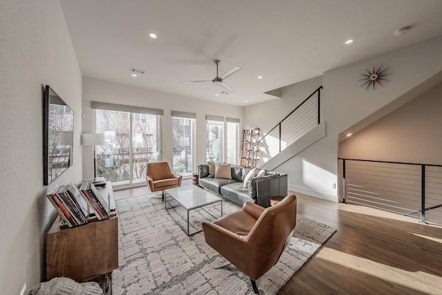 living area with visible vents, baseboards, recessed lighting, wood finished floors, and a ceiling fan