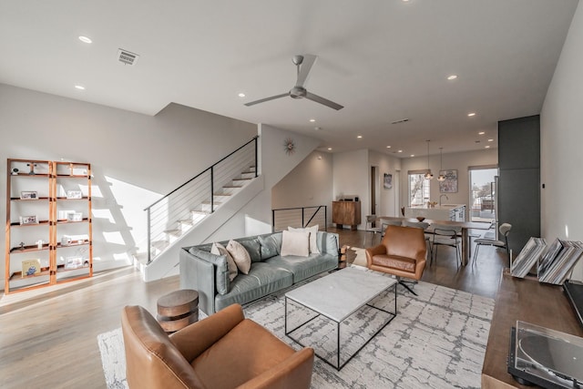 living room featuring visible vents, stairway, recessed lighting, wood finished floors, and a ceiling fan