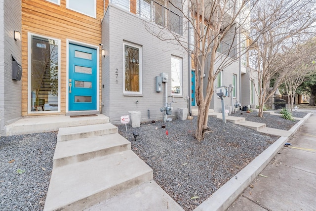 entrance to property with brick siding