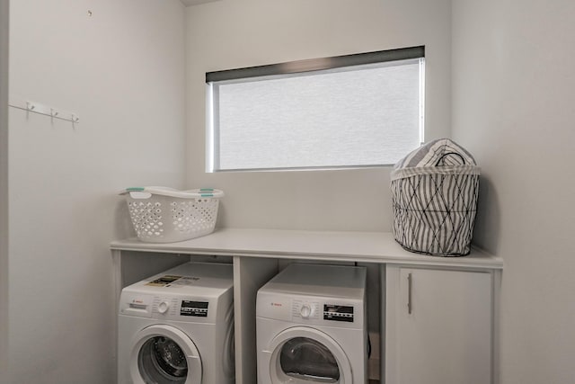 laundry room with independent washer and dryer and laundry area