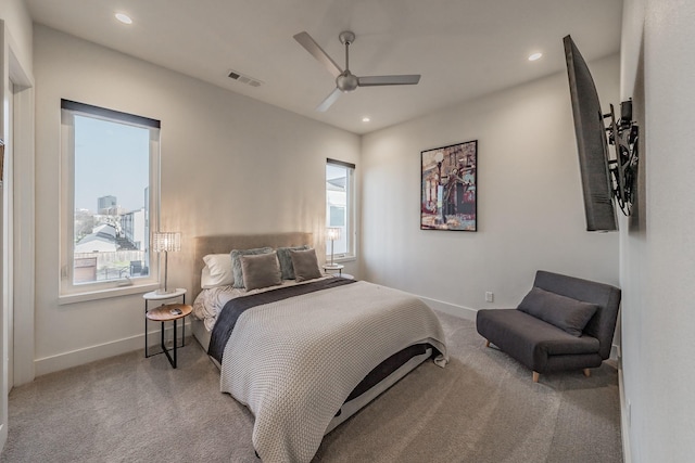 carpeted bedroom with recessed lighting, visible vents, baseboards, and ceiling fan