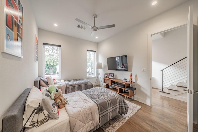 bedroom with visible vents, baseboards, recessed lighting, wood finished floors, and a ceiling fan