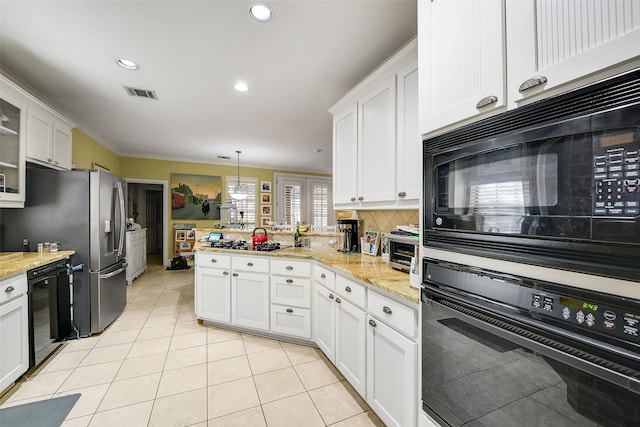 kitchen featuring light tile patterned floors, visible vents, a peninsula, black appliances, and white cabinets