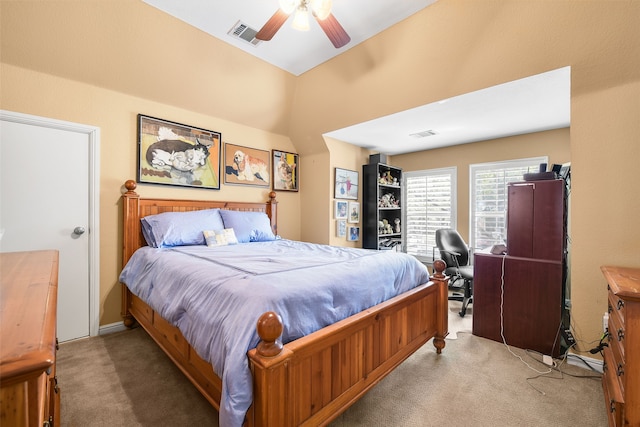 bedroom featuring a ceiling fan, vaulted ceiling, carpet, and visible vents