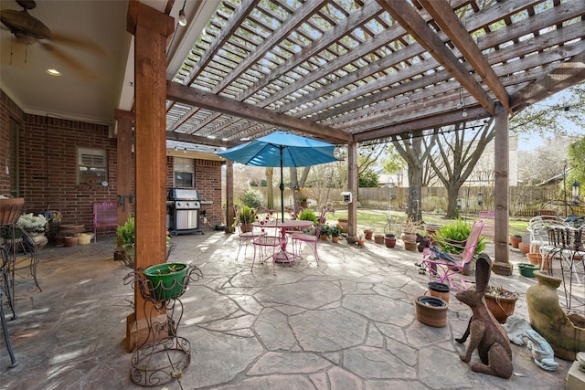 view of patio / terrace with outdoor dining space, fence, a pergola, and grilling area