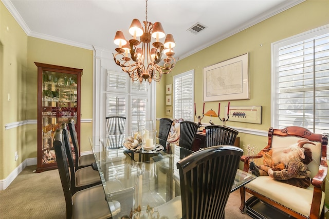 carpeted dining area with a chandelier, visible vents, a healthy amount of sunlight, and ornamental molding