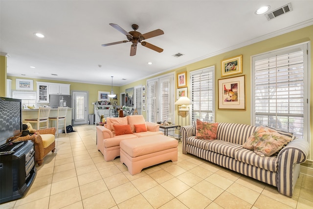 living area with visible vents, ornamental molding, recessed lighting, french doors, and light tile patterned floors