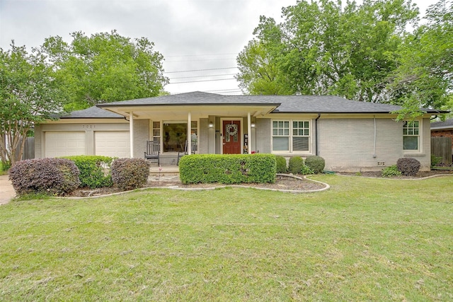 ranch-style home featuring a porch, a front yard, a garage, and brick siding