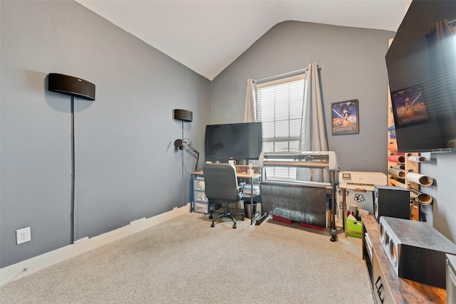 carpeted office with lofted ceiling