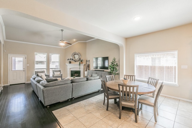 5113 Vieques Ln, Fort Worth, TX 76244 - dining room featuring baseboards, ornamental molding, ceiling fan, a fireplace, and recessed lighting