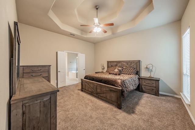 5113 Vieques Ln, Fort Worth, TX 76244 - bedroom featuring a raised ceiling, carpet floors, ensuite bath, ceiling fan, and baseboards