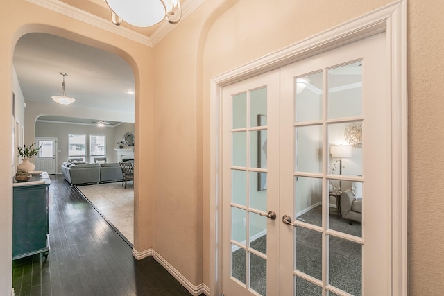5113 Vieques Ln, Fort Worth, TX 76244 - hall featuring arched walkways, french doors, hardwood / wood-style flooring, and crown molding