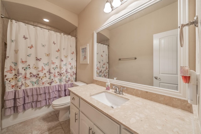 full bathroom with tile patterned flooring, vanity, toilet, and shower / tub combo