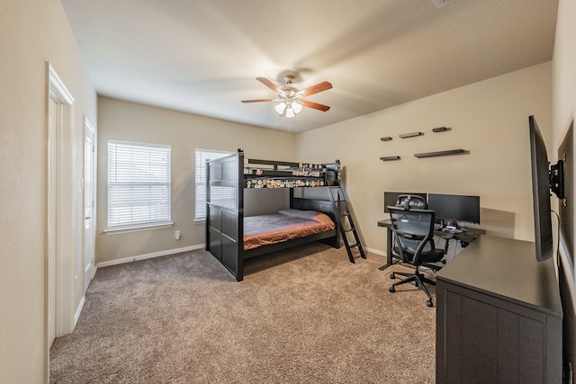 bedroom with baseboards, carpet floors, and ceiling fan