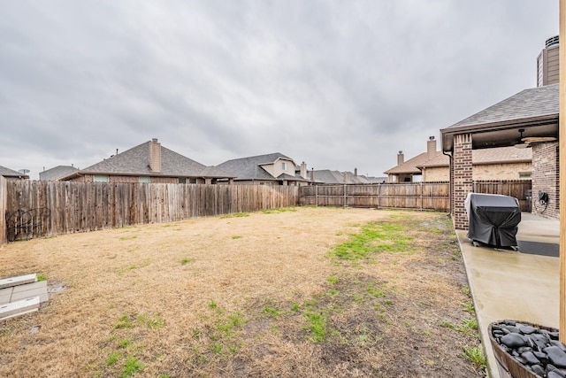 view of yard featuring a patio and a fenced backyard