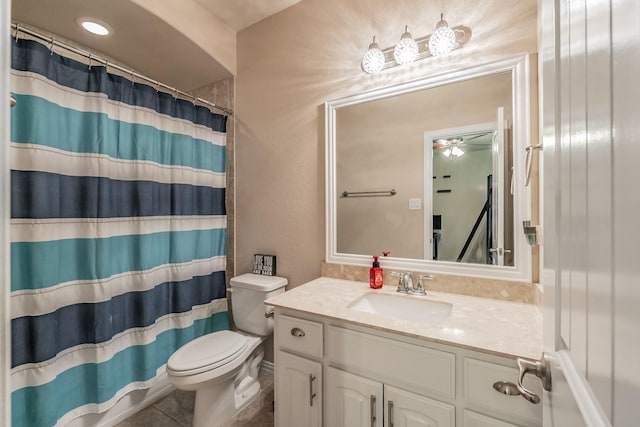 bathroom with tile patterned flooring, toilet, a shower with curtain, vanity, and a ceiling fan