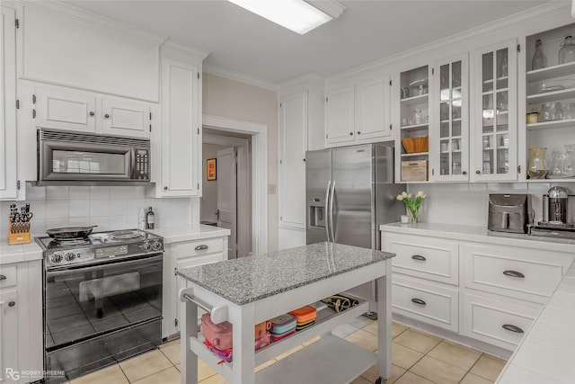 kitchen featuring open shelves, black appliances, and white cabinets