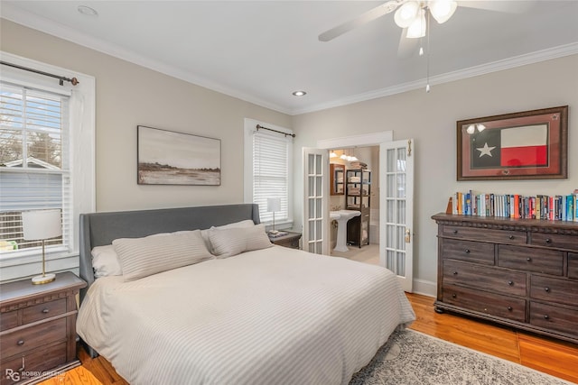 bedroom featuring light wood-type flooring, ornamental molding, a ceiling fan, recessed lighting, and french doors