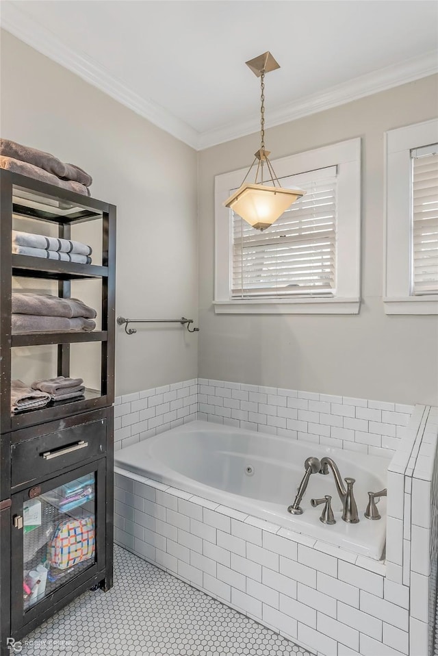 bathroom featuring tile patterned floors, a wealth of natural light, a garden tub, and ornamental molding