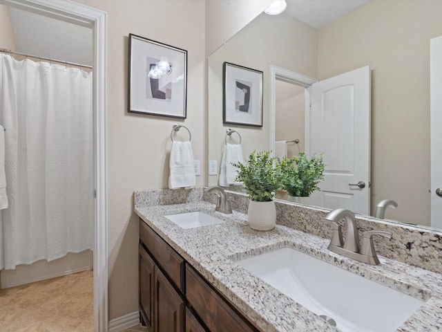 9466 Amberwoods Ln, Frisco, TX 75035 - full bathroom with double vanity and curtained shower