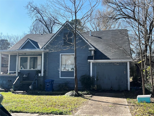 view of front of home with roof with shingles and a front yard