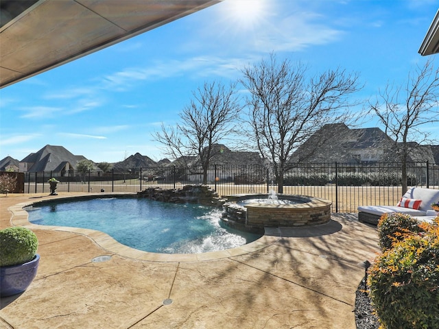 view of swimming pool with a patio area, a mountain view, a pool with connected hot tub, and fence