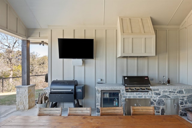 view of patio featuring area for grilling, an outdoor kitchen, outdoor dining space, and a sink