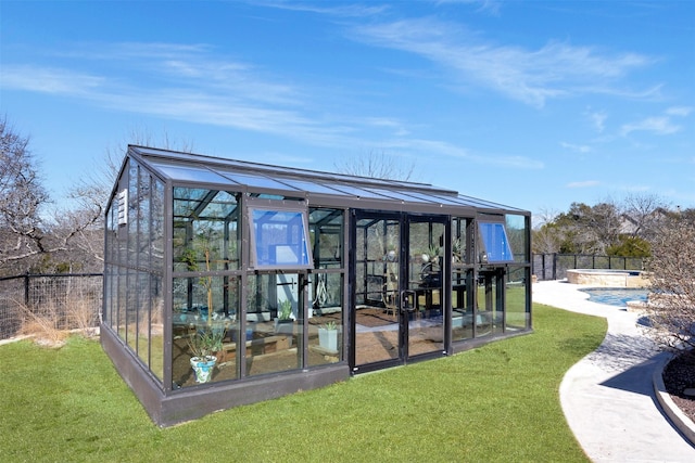 exterior space featuring a pool and a fenced backyard