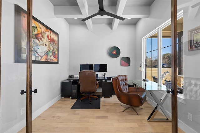 home office featuring beamed ceiling, french doors, light wood-type flooring, and baseboards