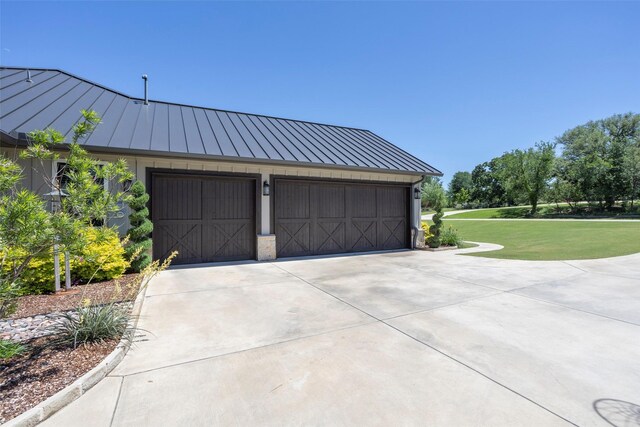 garage with concrete driveway