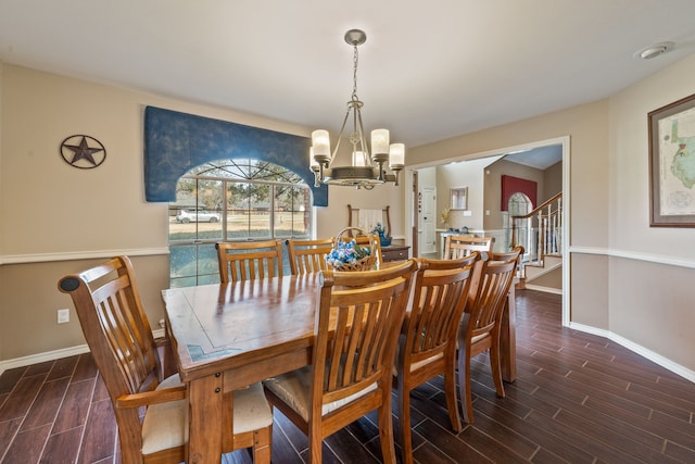 dining area with a notable chandelier, stairway, baseboards, and wood tiled floor