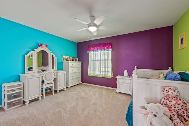 bedroom with a ceiling fan and carpet floors