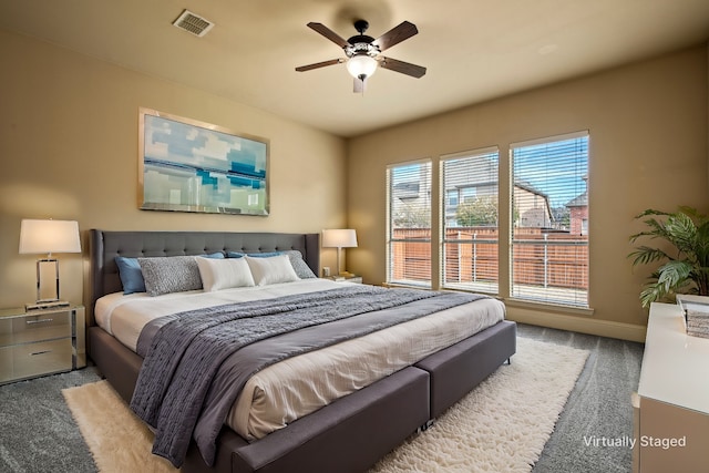 bedroom featuring ceiling fan, carpet, visible vents, and baseboards