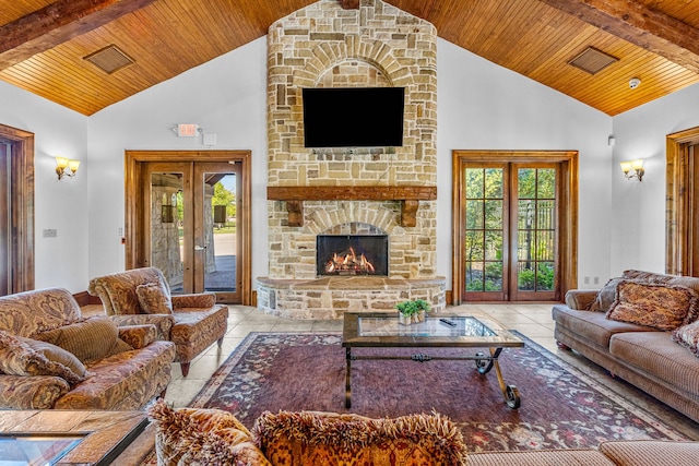 tiled living room featuring a fireplace, wooden ceiling, french doors, and high vaulted ceiling