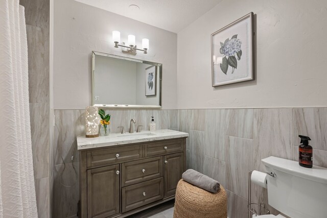 carpeted bedroom with a ceiling fan and baseboards