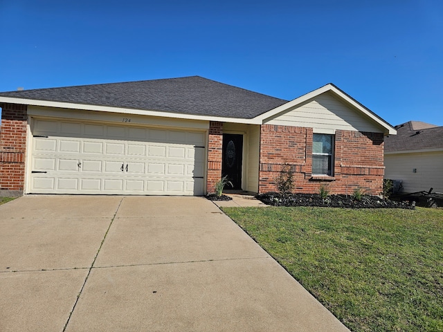 single story home featuring driveway, a front yard, a shingled roof, a garage, and brick siding