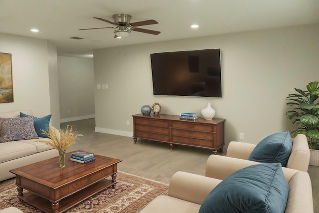 living area with recessed lighting, ceiling fan, baseboards, and wood finished floors