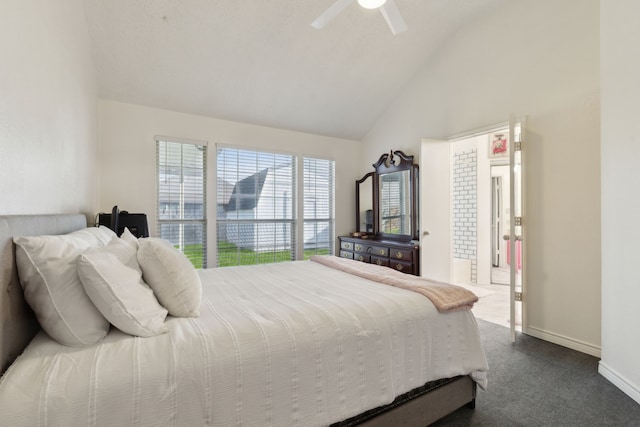 bedroom featuring baseboards, a ceiling fan, lofted ceiling, and dark colored carpet