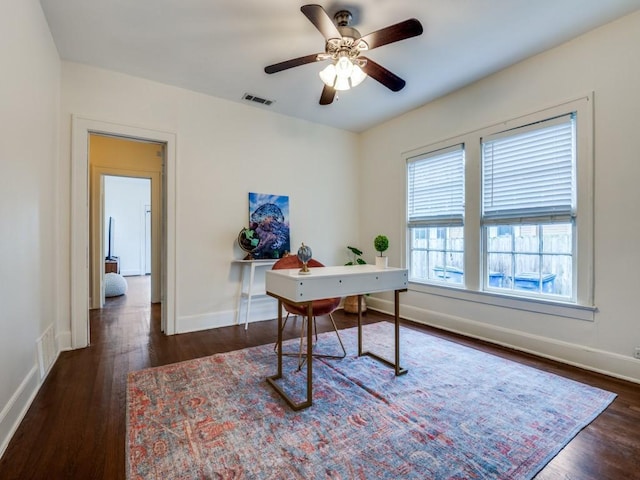 office with visible vents, baseboards, and wood finished floors