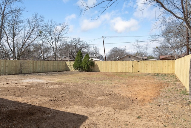 view of yard with a fenced backyard