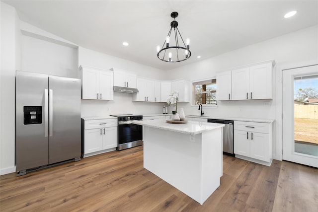 kitchen with dark wood finished floors, recessed lighting, stainless steel appliances, white cabinetry, and a sink