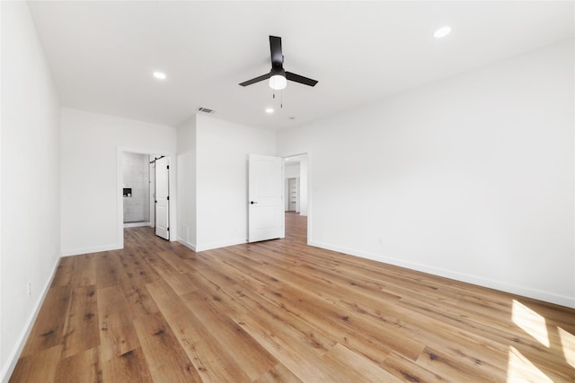 unfurnished bedroom with light wood finished floors, visible vents, recessed lighting, and baseboards