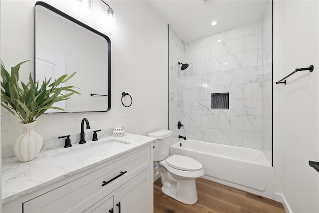 full bath with vanity, wood finished floors, recessed lighting, tub / shower combination, and toilet