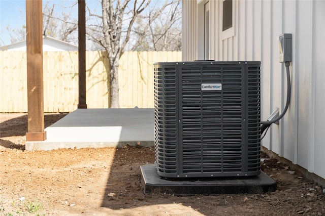 details with central AC unit and fence