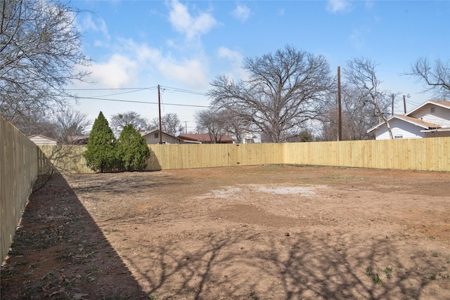 view of yard with a fenced backyard