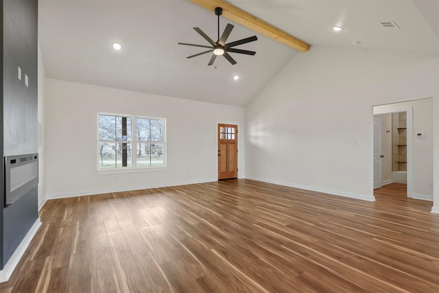 unfurnished living room with visible vents, baseboards, beamed ceiling, wood finished floors, and high vaulted ceiling