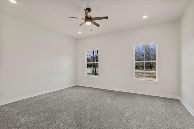 empty room with a wealth of natural light, baseboards, and recessed lighting