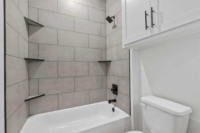 bathroom featuring shower / bathing tub combination and toilet